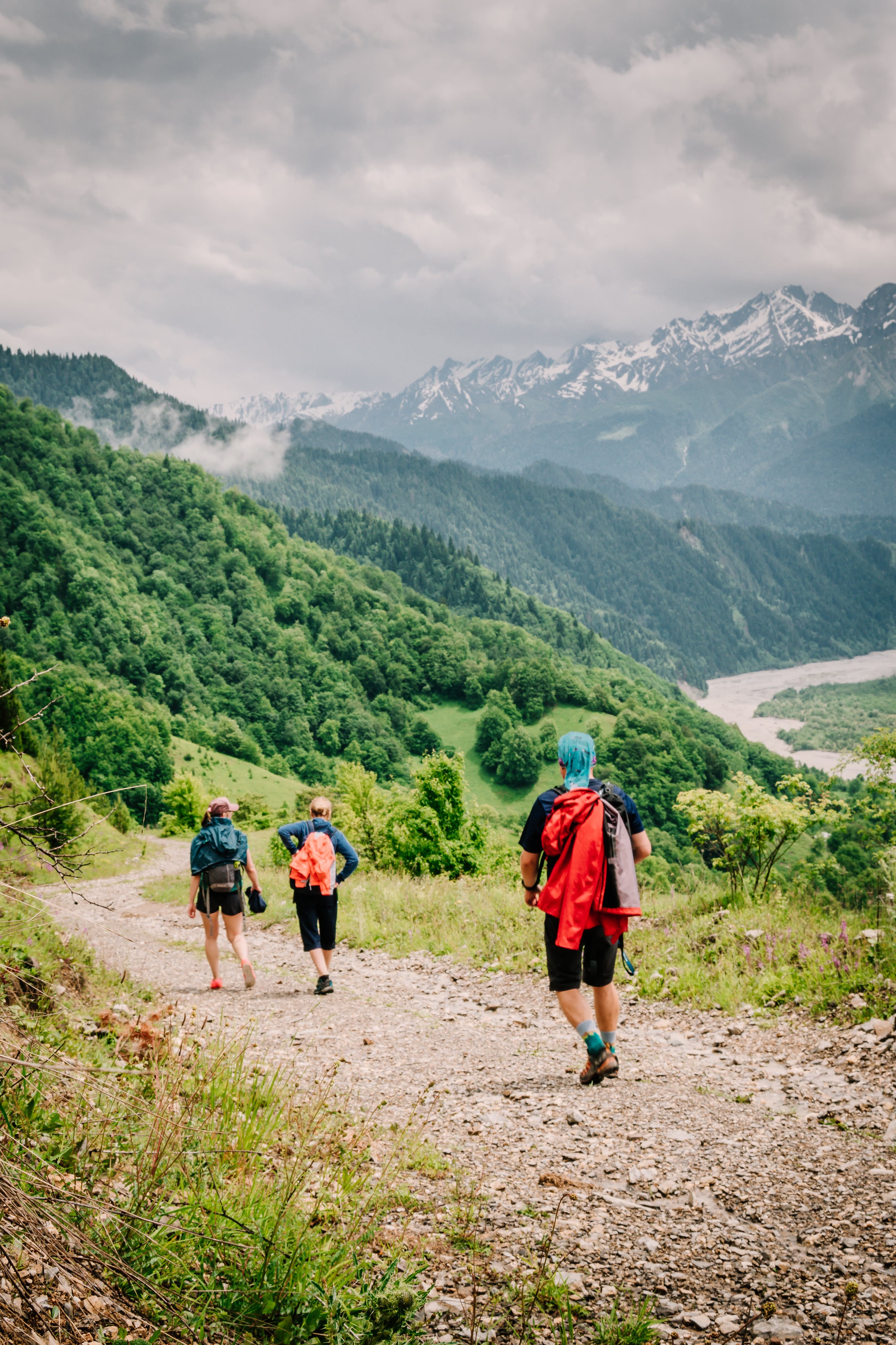 Hikers on alpine trail above Racha valley near Chiora village