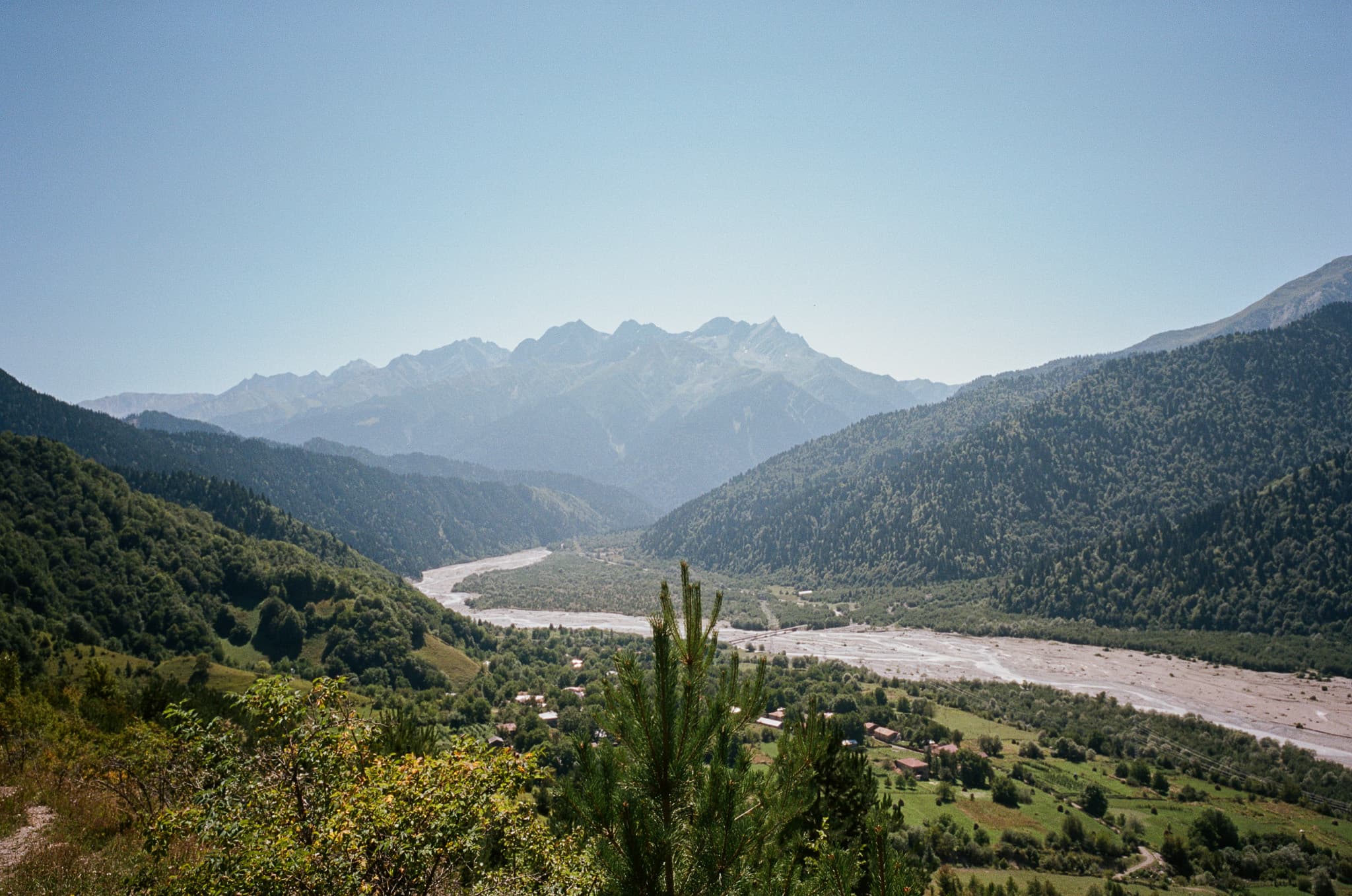Panoramic Racha valley with winding river and mountain road